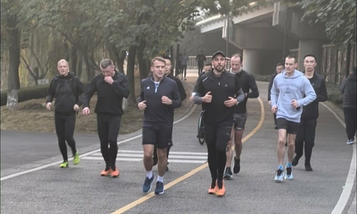 French president jogs in China park