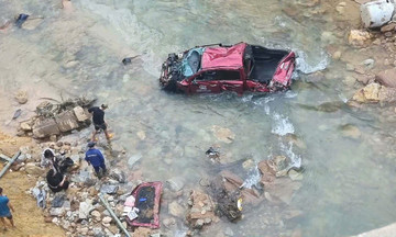 Pickup truck thrown over guardrail, plunges into stream