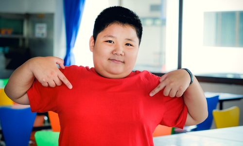 Does obesity affect adult height in children?