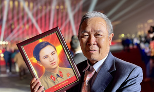 Families shed tears in poignant 'reunion' with fallen soldiers through restored portraits