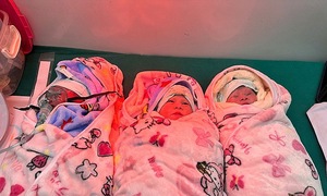 Woman with natural triplet pregnancy gives birth to three baby girls