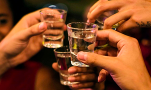 One dead, many hospitalized with suspected alcohol poisoning