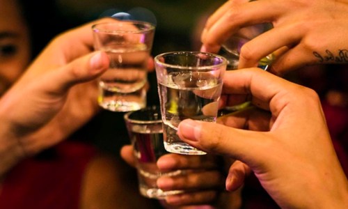 One dead, many hospitalized with suspected alcohol poisoning