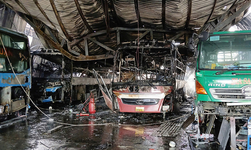 Garage fire destroys two passenger cars
