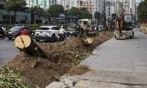 Series of intersections in Hanoi have sidewalks narrowed, road surfaces widened