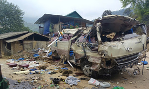 Scene of overturned vehicle carrying charity group in Lao Cai