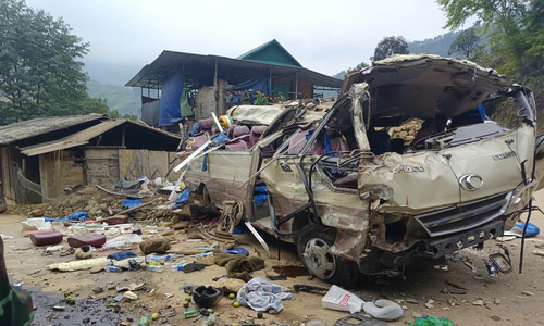 Scene of overturned vehicle carrying charity group in Lao Cai