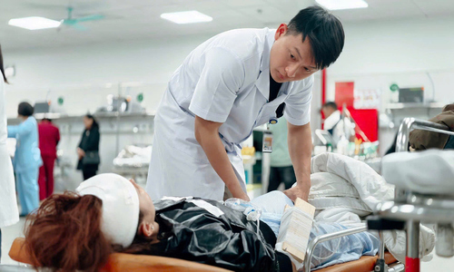 9 survivors of charity group bus crash transferred to Hanoi