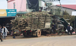 Truck crashes into house, one dead