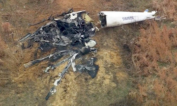 Two helicopters collide mid-air, one pilot killed