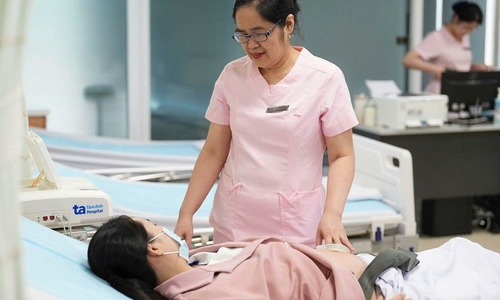 Why do in vitro fertilization pregnancies often experience severe morning sickness?