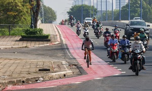 Why is the dedicated bicycle lane in Ho Chi Minh City painted red?