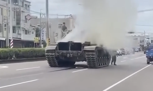 Tank billows thick smoke on Taiwan street