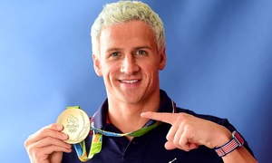US swimming legend sells three Olympic gold medals