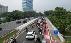 Motorcycles overflow into dedicated bicycle lane in Ho Chi Minh City