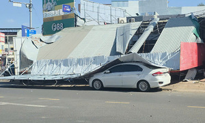 Signboard collapses, woman seriously injured