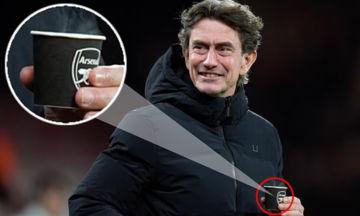 Tottenham coach criticized for holding Arsenal cup