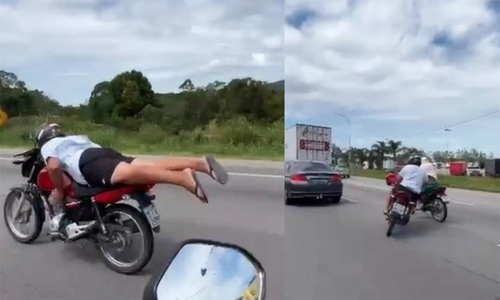 Motorcyclist crashes on highway after superman-style stunt