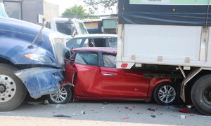 Car mangled under truck after multi-vehicle accident