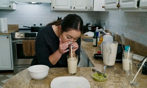 Woman consumes food through her nose