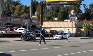 Police criticized for hiring pedestrians to cross the road to 'trap' drivers