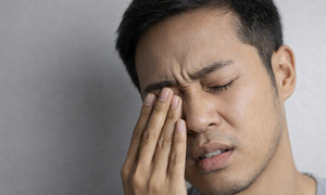 Why do eyelids twitch with headaches?