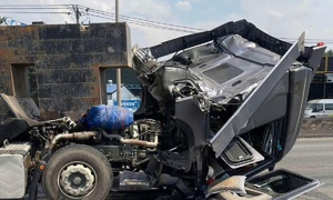 Iron containers crush tractor-trailer cabin on national highway 51