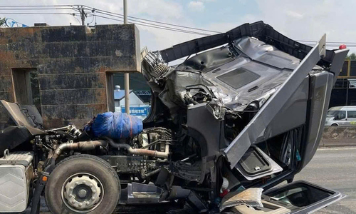 Iron containers crush tractor-trailer cabin on national highway 51