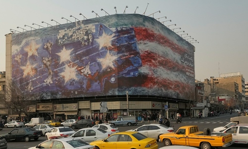 Iran unveils billboard depicting bloody US aircraft carrier, warns US to 'sow the wind, reap the whirlwind'
