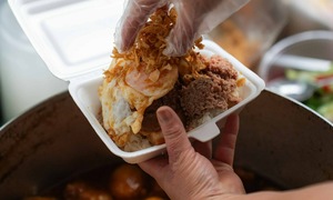 Over 40 years, a sticky rice stall keeps customers returning to Hanoi's Old Quarter sidewalk