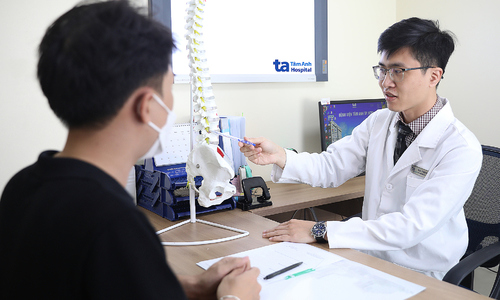 Why does prolonged sitting often lead to herniated discs?