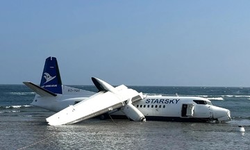 Passenger plane skids off runway, plunges onto coastline