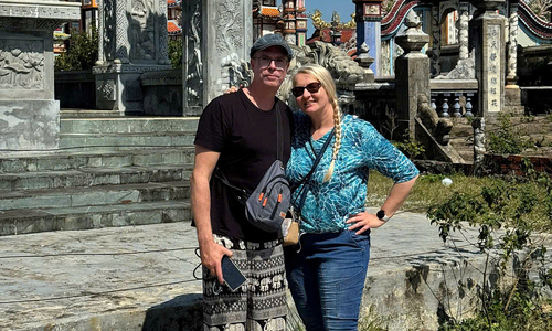 Western tourist fulfilled by exploring Vietnamese cemetery