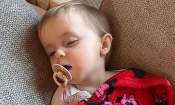 A 10-month-old baby experiences severe vomiting, suspected due to recalled milk formula