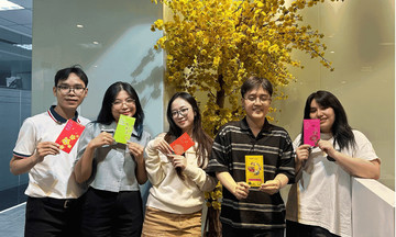 Office workers exchange lottery tickets as li xi
