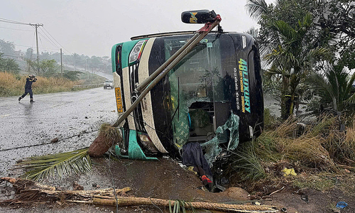 Bus carrying 32 people overturns on national highway 14