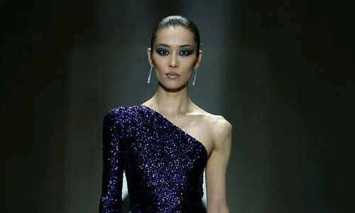 'China's most expensive supermodel' wears waist-high slit dress