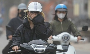 Dust chokes construction sites across Hanoi roads
