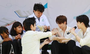 Singer Ho Dong Quan and students practice critical rescue skills