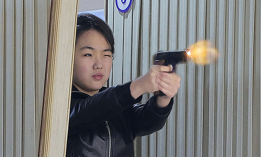 Kim Jong-un's daughter fires gun during weapons factory visit