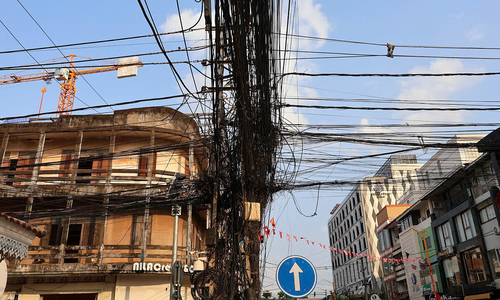 Tangled utility pole becomes a check-in spot in Laos