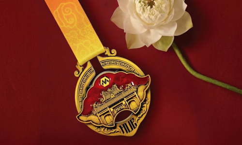 VnExpress Marathon Hue 2026 medal features khanh shape
