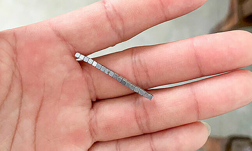 18 magnets form chain, perforating intestine of young boy