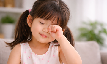 Why do children frequently rub their eyes?