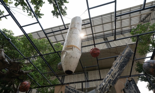 Airplane wreckage suspended for visitors to contemplate