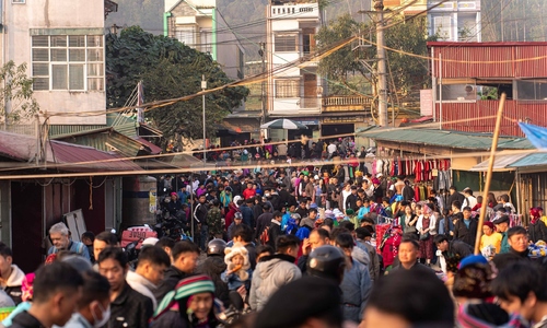 Tourists and locals flock to Dong Van Old Quarter's bustling weekend market