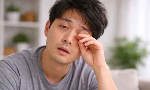 What do glossy eyes, as if covered by a film, indicate?