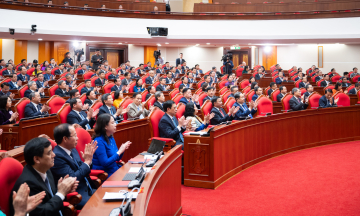 Delegates at the closing session of the 14th Party Central Committee's 2nd Plenum