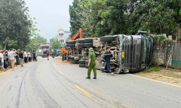 Truck overturns, killing two