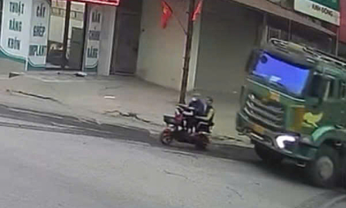 Truck driver using phone hits, kills two road users